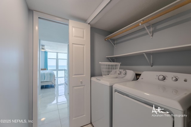 1301 1st St S Unit 1403, Jacksonville Beach, FL 32250 - washroom with independent washer and dryer and light tile patterned floors