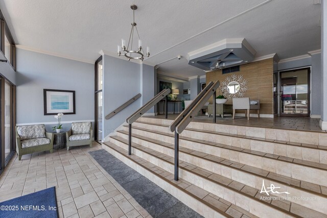 1301 1st St S Unit 1403, Jacksonville Beach, FL 32250 - foyer featuring a chandelier, ornamental molding, tile patterned flooring, and a textured ceiling