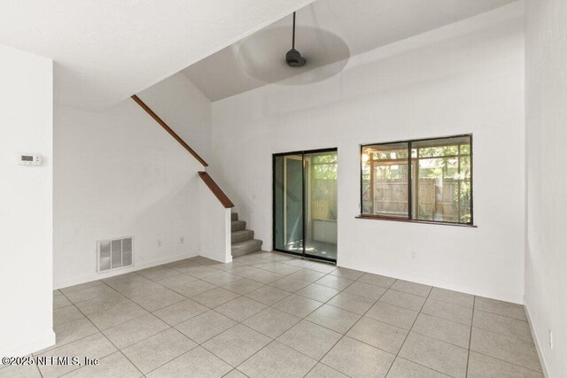 2885 Sand Castle Ln, Jacksonville, FL 32233 - unfurnished room featuring ceiling fan, stairs, and light tile patterned floors
