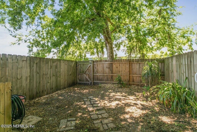 2885 Sand Castle Ln, Jacksonville, FL 32233 - fenced backyard featuring a gate