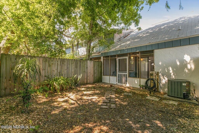 2885 Sand Castle Ln, Jacksonville, FL 32233 - fenced backyard featuring central AC unit and a sunroom