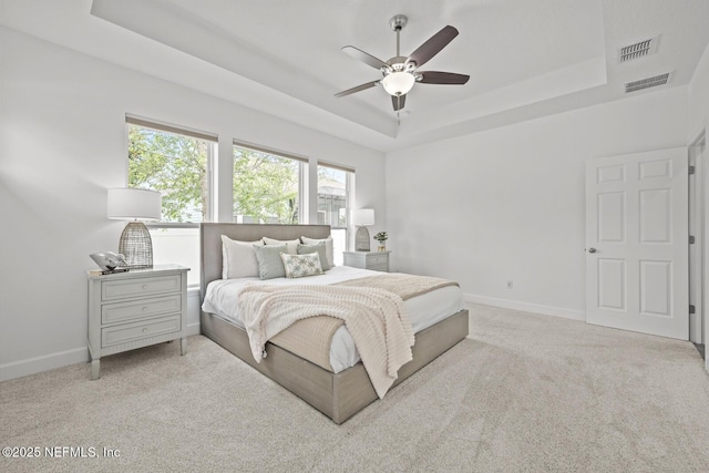 107 Park Lake Dr, Ponte Vedra, FL 32081 - bedroom with a raised ceiling, carpet floors, baseboards, and a ceiling fan