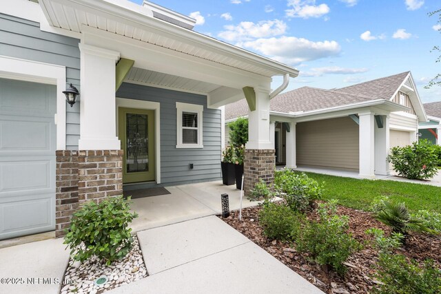 107 Park Lake Dr, Ponte Vedra, FL 32081 - view of exterior entry featuring covered porch and roof with shingles