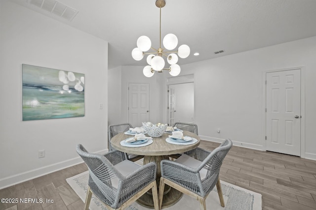 107 Park Lake Dr, Ponte Vedra, FL 32081 - dining area with a chandelier, wood finished floors, baseboards, and recessed lighting