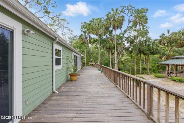 1418 Palm St NE, Steinhatchee, FL 32359 - wooden deck with a gazebo and view of scattered trees