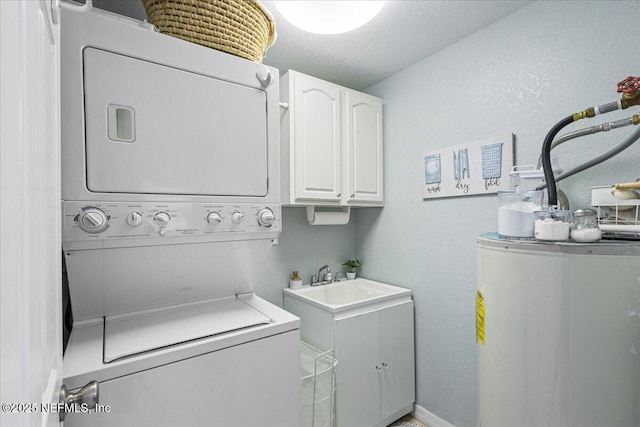 1418 Palm St NE, Steinhatchee, FL 32359 - washroom with estacked washer and dryer, water heater, cabinet space, and a textured wall