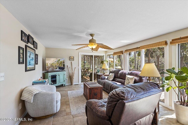 1418 Palm St NE, Steinhatchee, FL 32359 - living room with baseboards, a ceiling fan, and a textured ceiling