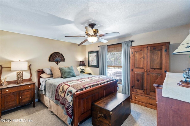 1418 Palm St NE, Steinhatchee, FL 32359 - bedroom with light carpet, a textured ceiling, a ceiling fan, and access to outside