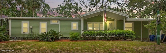 1418 Palm St NE, Steinhatchee, FL 32359 - ranch-style home with a yard