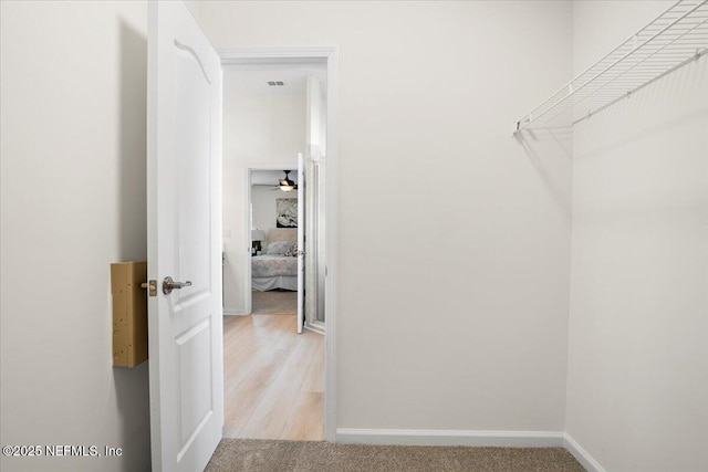 spacious closet with ceiling fan