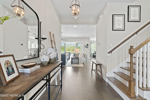 entrance foyer featuring a chandelier, wood finished floors, stairway, and recessed lighting