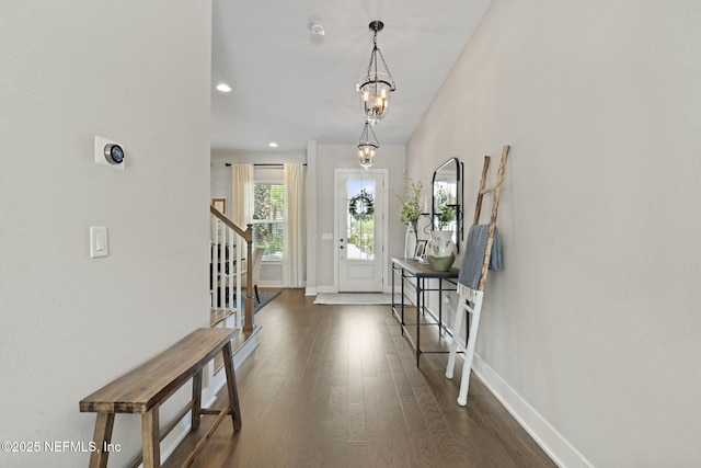 entryway with stairway, baseboards, dark wood-style floors, recessed lighting, and a chandelier