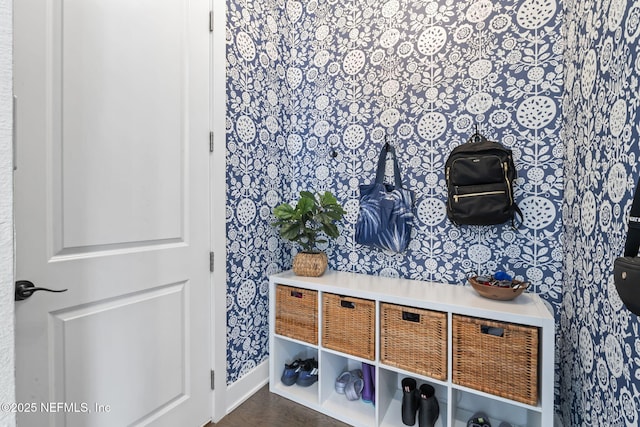 detailed view of wallpapered walls and baseboards