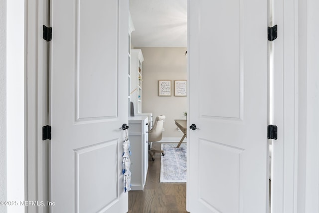 bathroom featuring wood finished floors and baseboards