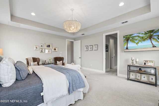 bedroom with a chandelier, carpet flooring, baseboards, a tray ceiling, and recessed lighting
