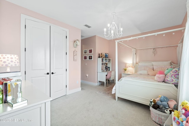 bedroom featuring a chandelier, light colored carpet, baseboards, and a closet
