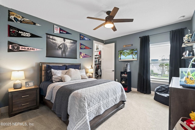 bedroom featuring carpet floors, baseboards, and a ceiling fan