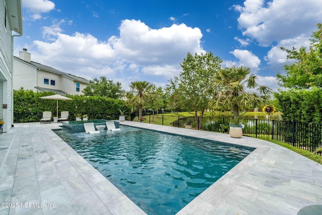 view of swimming pool with a patio area and fence