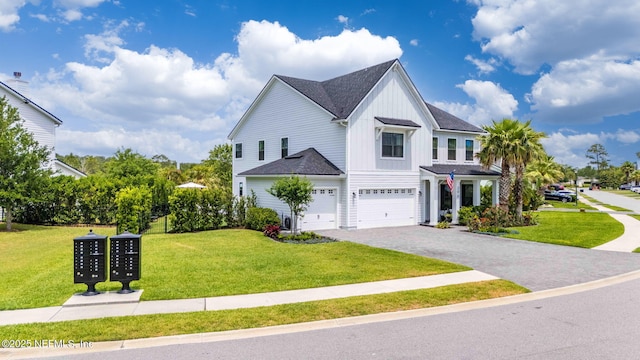 view of front facade with board and batten siding, an attached garage, a front yard, decorative driveway, and a shingled roof