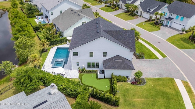 aerial perspective of suburban area with a pool