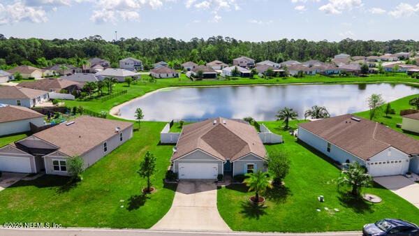aerial perspective of suburban area featuring a nearby body of water
