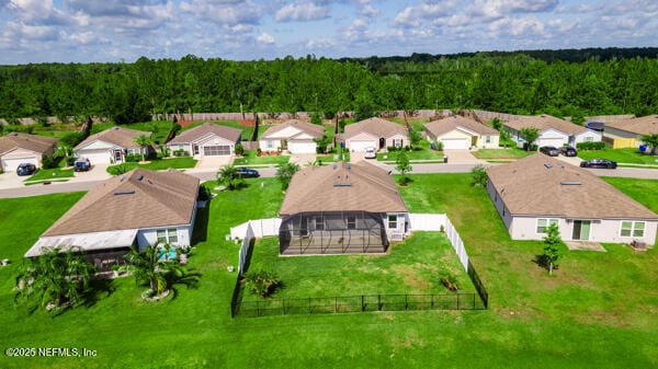 aerial view of residential area with a heavily wooded area