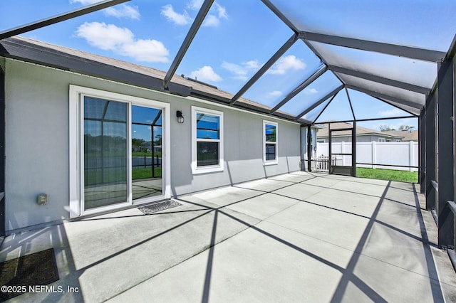 unfurnished sunroom featuring lofted ceiling