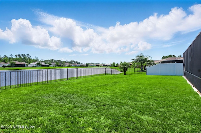 view of yard with a water view and a residential view
