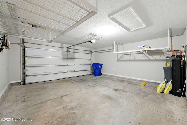 garage featuring a garage door opener and baseboards