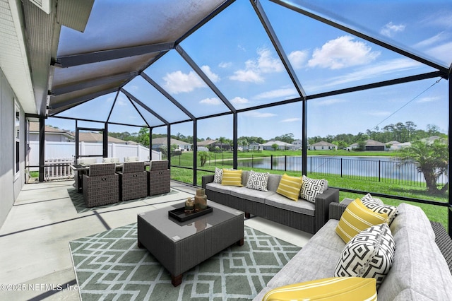 view of patio with an outdoor hangout area, a water view, a fenced backyard, glass enclosure, and a residential view