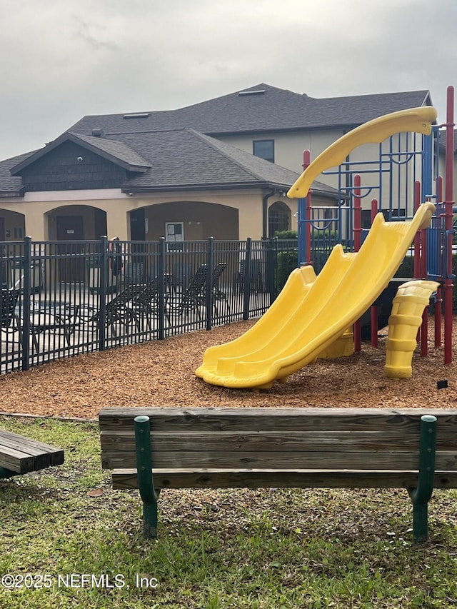 community jungle gym with fence