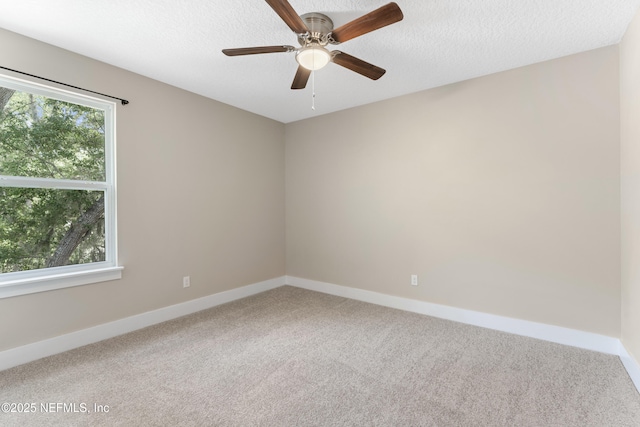 1339 Date St, Fernandina Beach, FL 32034 - empty room with carpet floors, baseboards, and ceiling fan