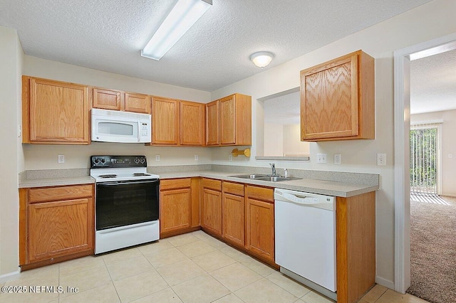 452 Dutton Island Rd W, Atlantic Beach, FL 32233 - kitchen with white appliances, a sink, a textured ceiling, light countertops, and light tile patterned flooring