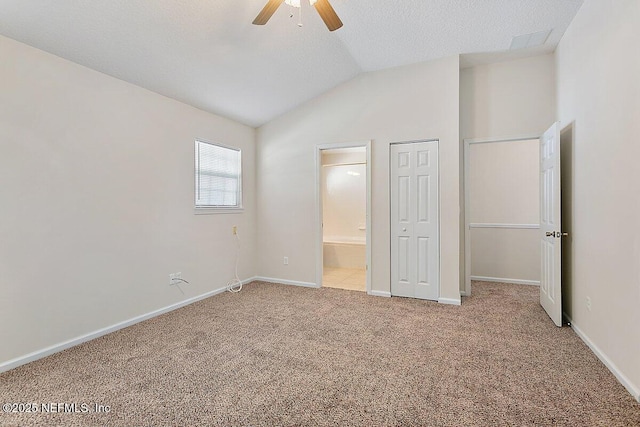 452 Dutton Island Rd W, Atlantic Beach, FL 32233 - unfurnished bedroom with carpet flooring, vaulted ceiling, ensuite bath, baseboards, and ceiling fan