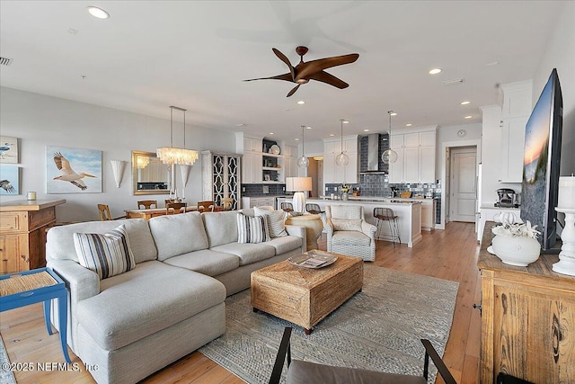 2540 Beach Blvd, Jacksonville Beach, FL 32250 - living area with a ceiling fan, light wood finished floors, recessed lighting, and a chandelier