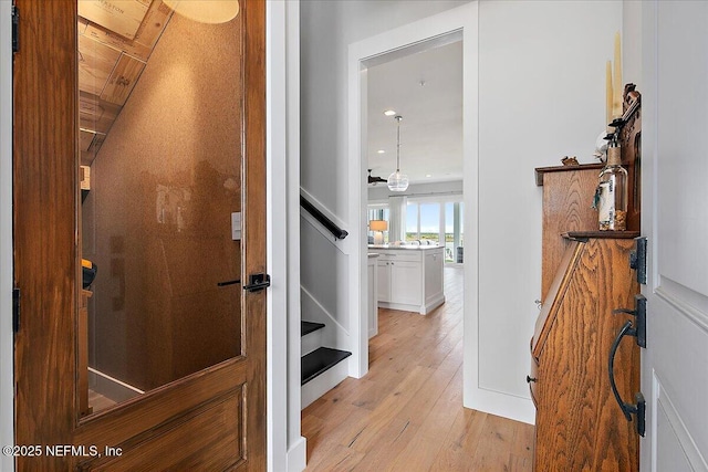 2540 Beach Blvd, Jacksonville Beach, FL 32250 - hallway featuring light wood finished floors and stairway