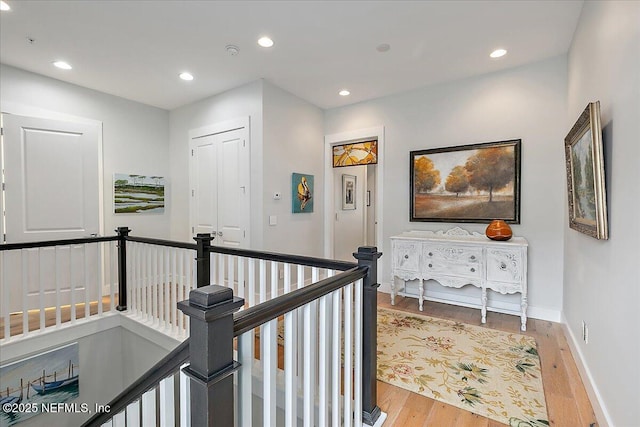 2540 Beach Blvd, Jacksonville Beach, FL 32250 - corridor with an upstairs landing, wood finished floors, recessed lighting, and baseboards