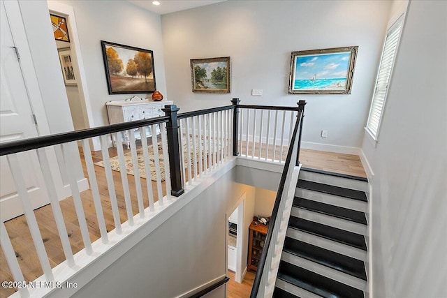 2540 Beach Blvd, Jacksonville Beach, FL 32250 - stairway featuring baseboards, recessed lighting, and wood finished floors
