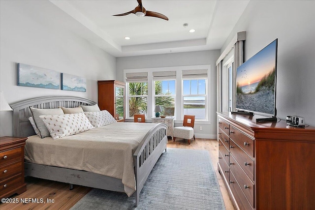 2540 Beach Blvd, Jacksonville Beach, FL 32250 - bedroom featuring light wood-style floors, a raised ceiling, recessed lighting, and a ceiling fan