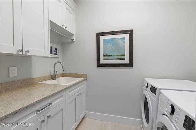 2540 Beach Blvd, Jacksonville Beach, FL 32250 - laundry room with washer and dryer, cabinet space, and baseboards