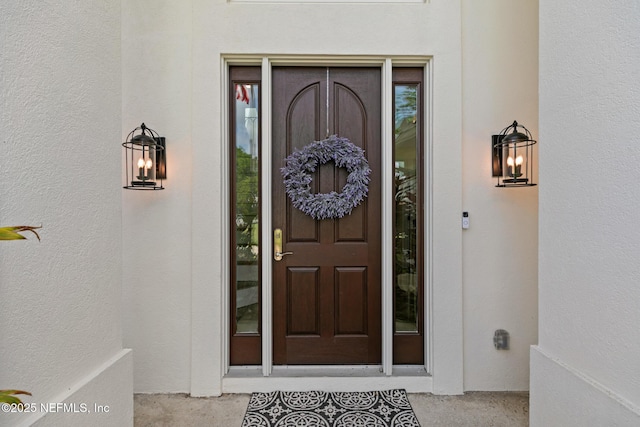 doorway to property with stucco siding