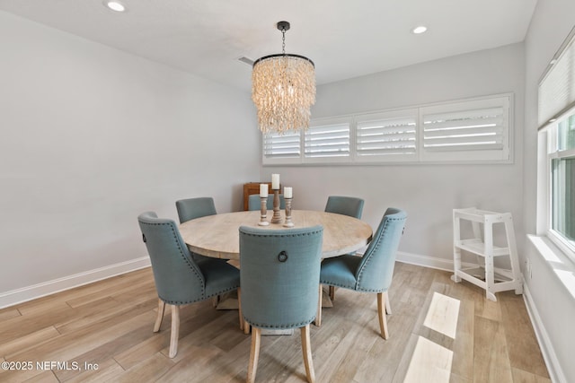 dining area with a chandelier, light wood-style floors, baseboards, and recessed lighting