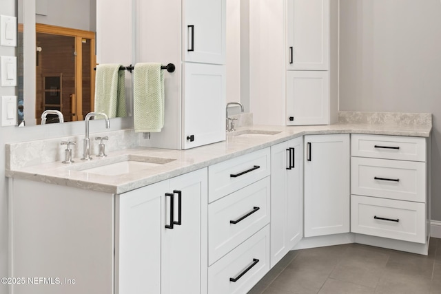 bathroom featuring tile patterned floors and double vanity