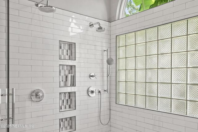 bathroom with a tile shower
