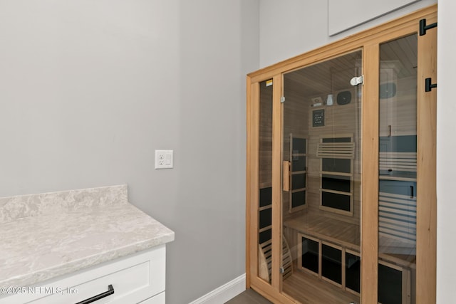 sauna / steam room with baseboards