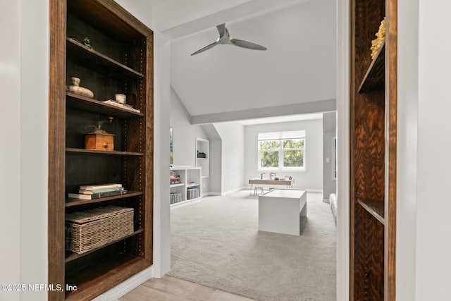 walk in closet featuring carpet flooring, ceiling fan, and vaulted ceiling