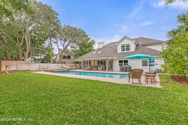 rear view of house featuring a patio area, an outdoor living space, roof with shingles, a chimney, and stucco siding