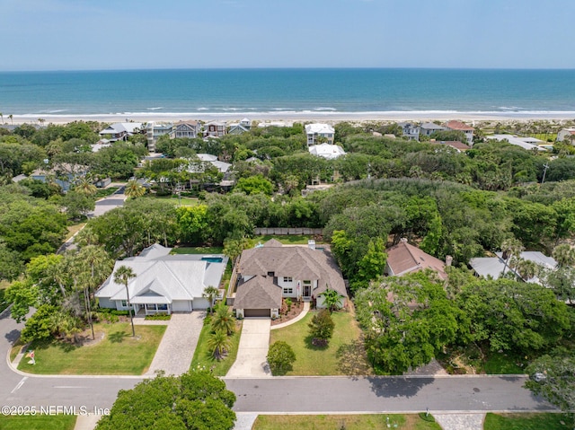 drone / aerial view of waterfront with a beach