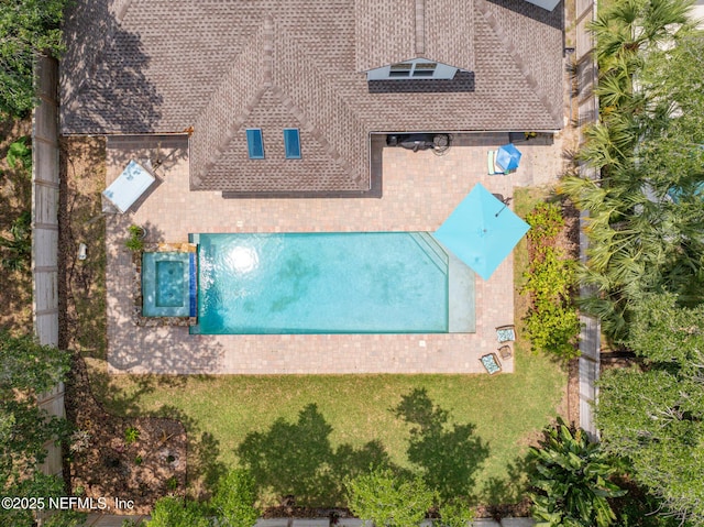 view of subject property with a pool