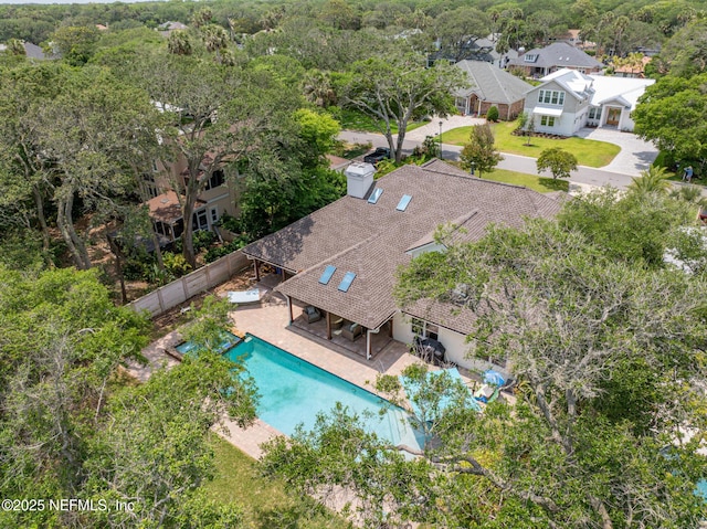 view of subject property with a pool area